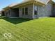 House exterior showcasing a backyard with grassy lawn at 2170 Galleone Way, Plainfield, IN 46168