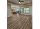 Spacious living room with hardwood floors and kitchen views at 2170 Galleone Way, Plainfield, IN 46168