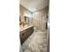 Elegant bathroom with double vanity, marble floors, and a soaking tub at 2170 Galleone Way, Plainfield, IN 46168