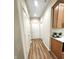 Bright hallway with hardwood floors and neutral-colored walls at 2170 Galleone Way, Plainfield, IN 46168