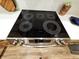 Sleek, black glass cooktop with multiple heating elements at 2170 Galleone Way, Plainfield, IN 46168