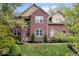 Brick two-story house with a manicured lawn at 8418 Mesic Ct, Indianapolis, IN 46278
