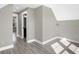 Light-filled hallway with hardwood floors and access to bathroom at 1019 N Beville Ave, Indianapolis, IN 46201