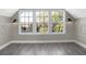 Bonus room with three large windows and wood-look floors at 1019 N Beville Ave, Indianapolis, IN 46201