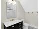 Modern bathroom with black vanity and white subway tiles at 1019 N Beville Ave, Indianapolis, IN 46201