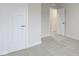 Bright bedroom with grey carpet and white doors at 6293 Loraine Dr, Brownsburg, IN 46112