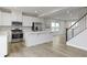 Open concept kitchen with island and stainless steel appliances at 6293 Loraine Dr, Brownsburg, IN 46112