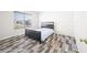 Well-lit bedroom featuring wood-look floors and a built-in closet at 2900 Lakestream Dr, Columbus, IN 47201
