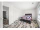 Neat bedroom with wood-look floors and striped bedding at 2900 Lakestream Dr, Columbus, IN 47201
