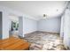 Open living room with wood-look floors and view into another room at 2900 Lakestream Dr, Columbus, IN 47201