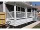 Newly renovated front porch with white railing and landscaping at 3131 Boulevard Pl, Indianapolis, IN 46208