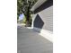 Side yard with concrete driveway and mature tree at 3131 Boulevard Pl, Indianapolis, IN 46208