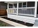 Newly renovated front porch with white railing and landscaping at 3131 Boulevard Pl, Indianapolis, IN 46208
