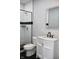 Stylish bathroom featuring a white vanity, marble countertop, and black and white tile shower at 3131 Boulevard Pl, Indianapolis, IN 46208