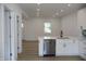 Modern kitchen with white shaker cabinets, quartz countertops, and stainless steel appliances at 3131 Boulevard Pl, Indianapolis, IN 46208