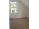 Bright bedroom with neutral carpeting and a window at 3131 Boulevard Pl, Indianapolis, IN 46208
