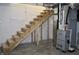 Unfinished basement with wooden stairs and new HVAC system at 3131 Boulevard Pl, Indianapolis, IN 46208