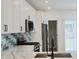 Modern kitchen with white cabinets, quartz countertops and stainless steel appliances at 3131 Boulevard Pl, Indianapolis, IN 46208