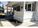 Renovated front porch with gray steps and white stonework at 3131 Boulevard Pl, Indianapolis, IN 46208