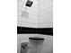 Close-up of a shower with black and white subway tile and a built-in shelf at 3131 Boulevard Pl, Indianapolis, IN 46208