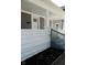 Front porch detail showcasing white pillars and gray railing at 3131 Boulevard Pl, Indianapolis, IN 46208