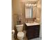 Bathroom features vanity with dark brown cabinets and a mirrored medicine cabinet at 108 W 650 South, Pendleton, IN 46064