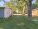 House side view, landscaping, and large trees at 108 W 650 South, Pendleton, IN 46064