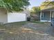 View of detached garage and home's exterior at 108 W 650 South, Pendleton, IN 46064