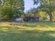Ranch home with a covered porch, two-car garage, and a large yard at 108 W 650 South, Pendleton, IN 46064