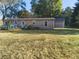 Rear view of house, showing yard and deck at 108 W 650 South, Pendleton, IN 46064
