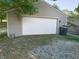 Detached garage with white door and gravel driveway at 108 W 650 South, Pendleton, IN 46064