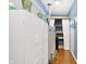 Laundry room with white cabinets, a water heater, and shelving at 3688 Lisa Ln, Plainfield, IN 46168