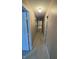 Long hallway with neutral walls and carpeted floors at 4501 N Wheeling Ave # 7A-205, Muncie, IN 47304