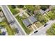 Two-house property with gray siding, wooden decks, and green lawns at 3006 N Olney St, Indianapolis, IN 46218