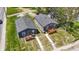 Two-house property with gray siding, wooden decks, and green lawns at 3006 N Olney St, Indianapolis, IN 46218