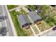 Two-house property with gray siding, wooden decks, and green lawns at 3006 N Olney St, Indianapolis, IN 46218