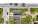 Two-house property with gray siding, wooden decks, and green lawns at 3006 N Olney St, Indianapolis, IN 46218