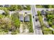 Two-house property with gray siding, wooden decks, and green lawns at 3006 N Olney St, Indianapolis, IN 46218