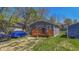 House with wooden deck and parked cars at 3006 N Olney St, Indianapolis, IN 46218