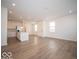 Open concept kitchen with island and stainless steel appliances at 6272 Wasco Dr, Whitestown, IN 46075