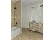 Bathroom with a double vanity, bathtub, and shower at 525 Schmitt Rd, Indianapolis, IN 46239