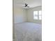 Spacious bedroom with neutral walls, plush carpeting, and a ceiling fan at 525 Schmitt Rd, Indianapolis, IN 46239