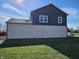 Rear view of a two story home with white brick at 525 Schmitt Rd, Indianapolis, IN 46239
