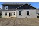 Home's back exterior features a deck and white brick at 525 Schmitt Rd, Indianapolis, IN 46239