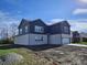 Two-story home showcasing a side view and landscaping at 525 Schmitt Rd, Indianapolis, IN 46239