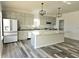 Modern kitchen with island, stainless steel appliances, and gray cabinets at 525 Schmitt Rd, Indianapolis, IN 46239