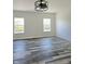 Bright living room with hardwood floors and two windows at 525 Schmitt Rd, Indianapolis, IN 46239