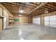Large unfinished garage with high ceilings and concrete floor at 5724 N Blazing Star Rd, Monrovia, IN 46157