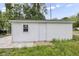 Detached garage with a single door and window at 1472 N Grant Ave, Indianapolis, IN 46201