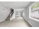 Spacious living room with hardwood floors and lots of natural light at 1472 N Grant Ave, Indianapolis, IN 46201